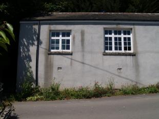 *West end of south-facing front wall-r